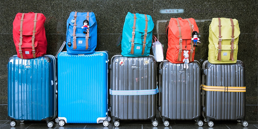 An array of colourful luggage, ready to go.